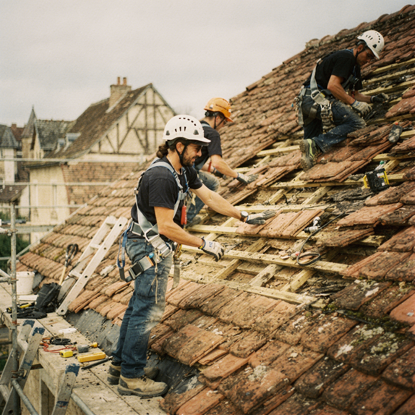freepik professional roofer team renovating a tiled roof o 71763